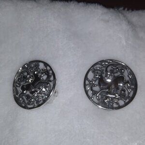 Sarah Cov.: Silver tone running deer design round earrings.